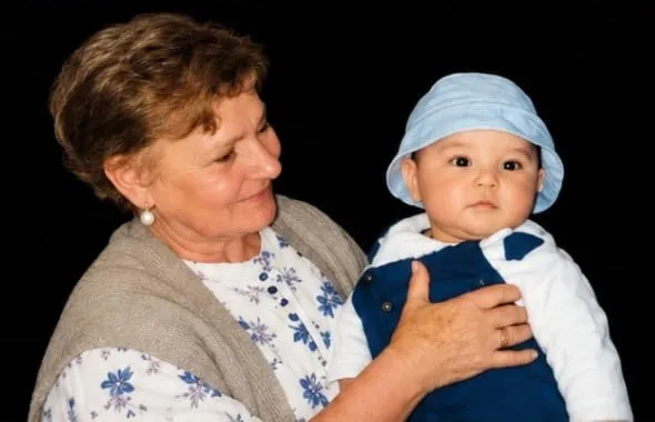Giannina Espinoza’s mother holding a young child.